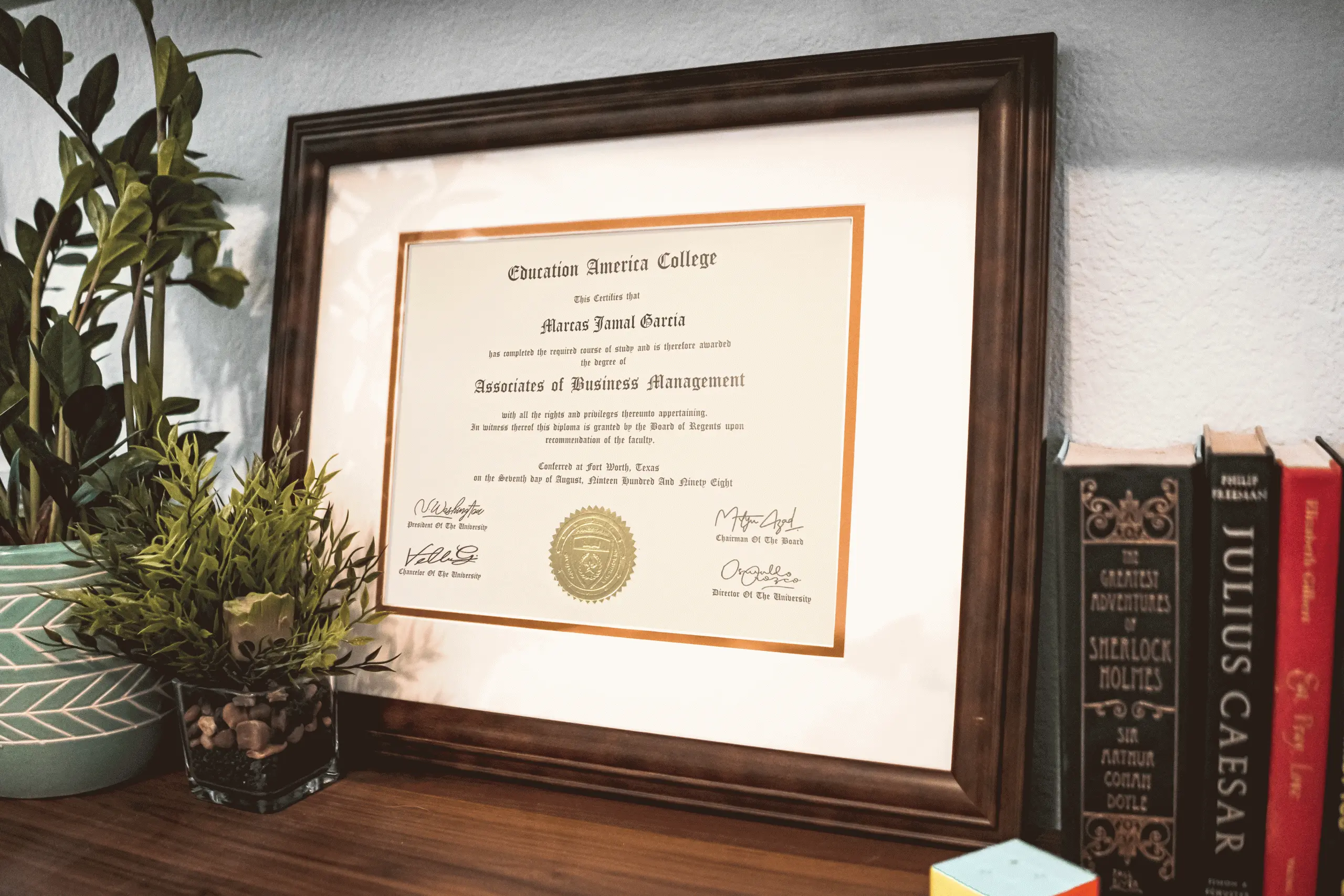 Fake college degree from ValidGrad showcased in a wooden frame