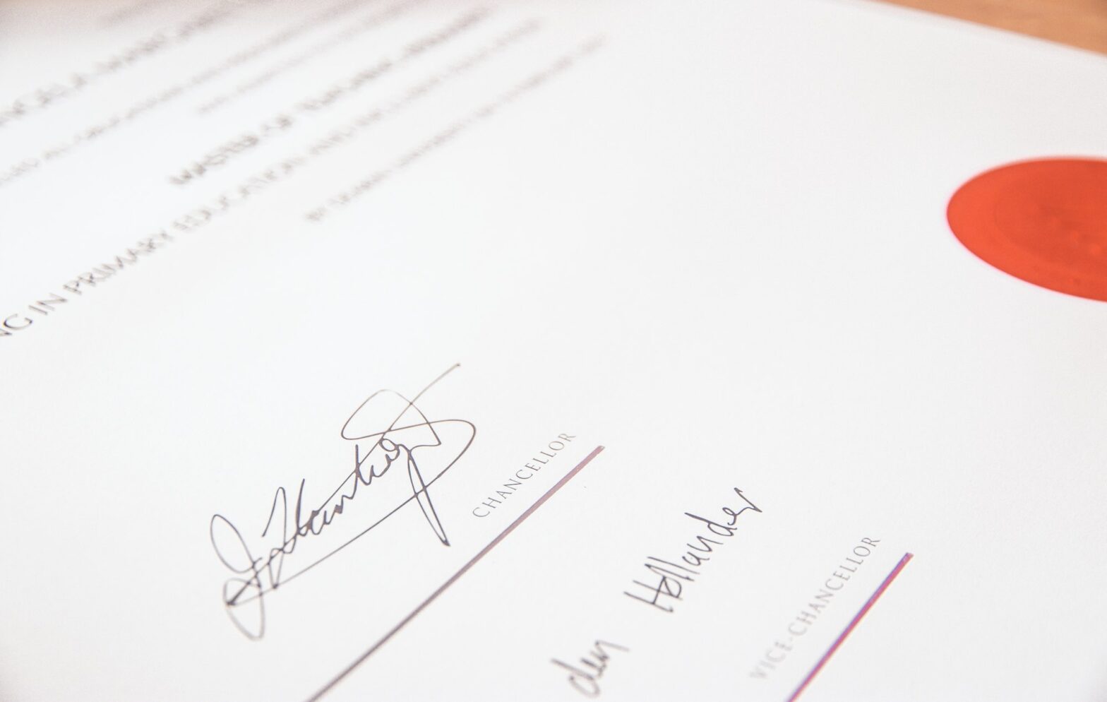 A close-up of a graduation certificate with a gold seal, illustrating a professional certificate of completion template